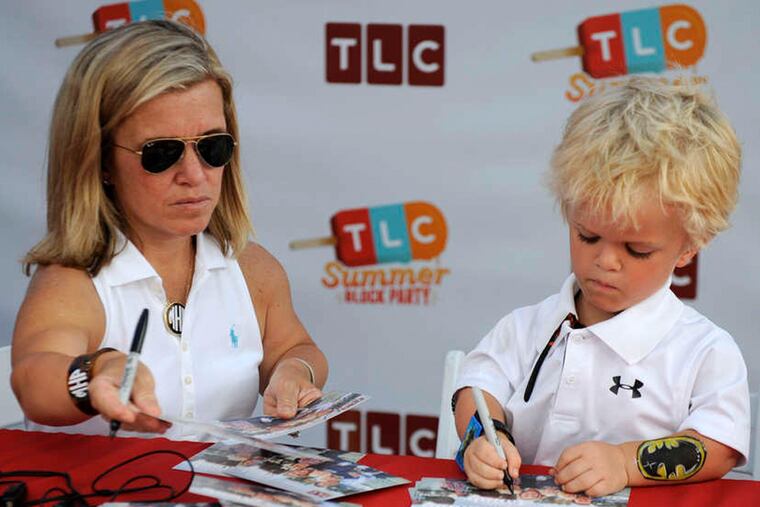 Michelle Hamill and son Jack, 6, of "Our Little Family" sign autographs during the TLC Summer Block Party.