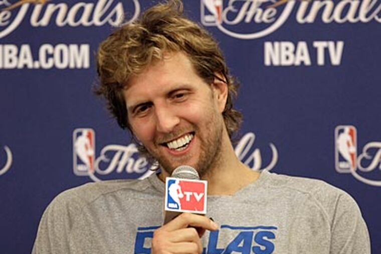 The Mavericks' Dirk Nowitzki answers questions at a press conference on Saturday. (David J. Phillip/AP Photo)