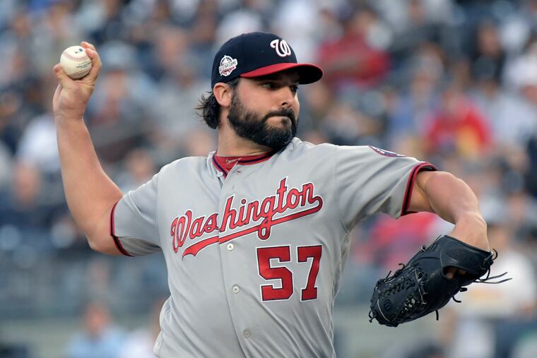 FILE - In this Tuesday, June 12, 2018 file photo, Washington Nationals pitcher Tanner Roark delivers the ball to a New York Yankees batter during the first inning of a baseball game at Yankee Stadium in New York. The Washington Nationals have traded Tanner Roark to the Reds for another right-hander named Tanner, less proven Tanner Rainey. Washington boosted its rotation by signing Patrick Corbin to a $140 million, six-year contract last week. The Nationals went 82-80 and finished second in the NL East behind Atlanta and missed the playoffs following two straight trips and defeats in the NL division series. (AP Photo/Bill Kostroun, File)