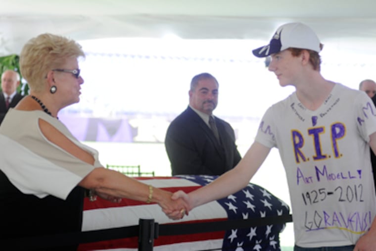 Sam Miller, the executive assistant to former Baltimore Ravens owner Art Modell, shakes hands with a fan during a public viewing (Steve Ruark/AP Photo)