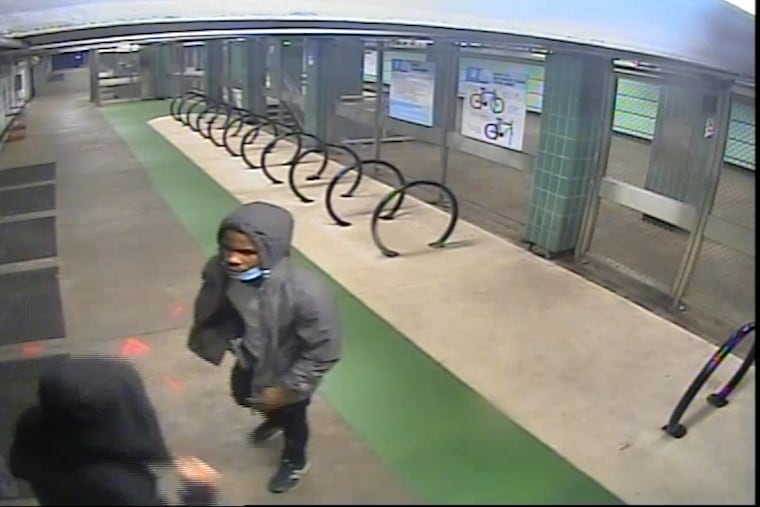 Surveillance video at SEPTA's Tasker-Morris station showed the man in the grey hoodie approach a person from behind, then fire a gun at them. No one was injured. Robert Davis, 19, has been charged in the shooting.