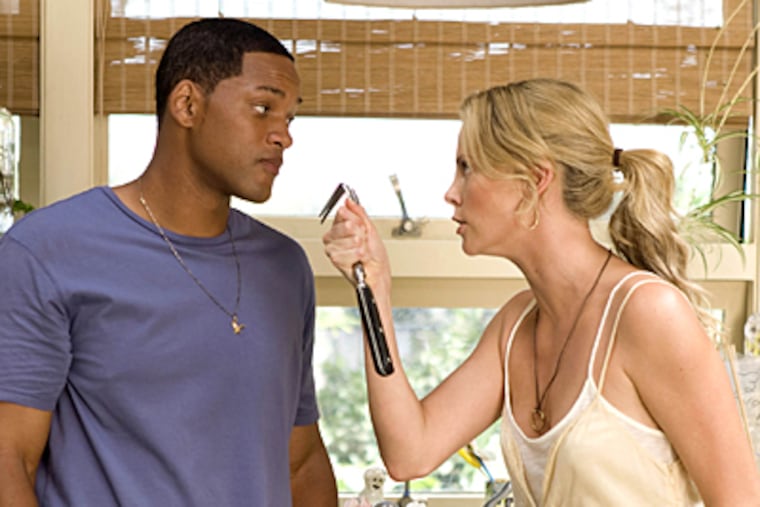 Will Smith and Charlize Theron in a scene from "Hancock," which opens in theaters Wednesday.