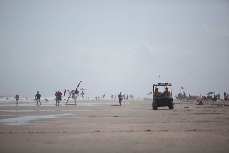 North Wildwood Police officers patrol the beach in 2017. On Tuesday, a woman died after attempting to rescue her children from rough waters.
