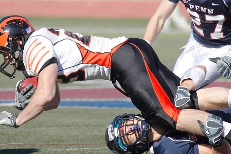 Penn safety Sabastian Jakowski makes a tackle against Princeton. (Akira Suwa/Staff Photographer)