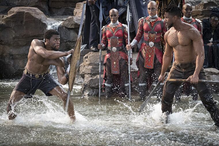 Chadwick Boseman and Michael B. Jordan are jacked in the film "Black Panther." (