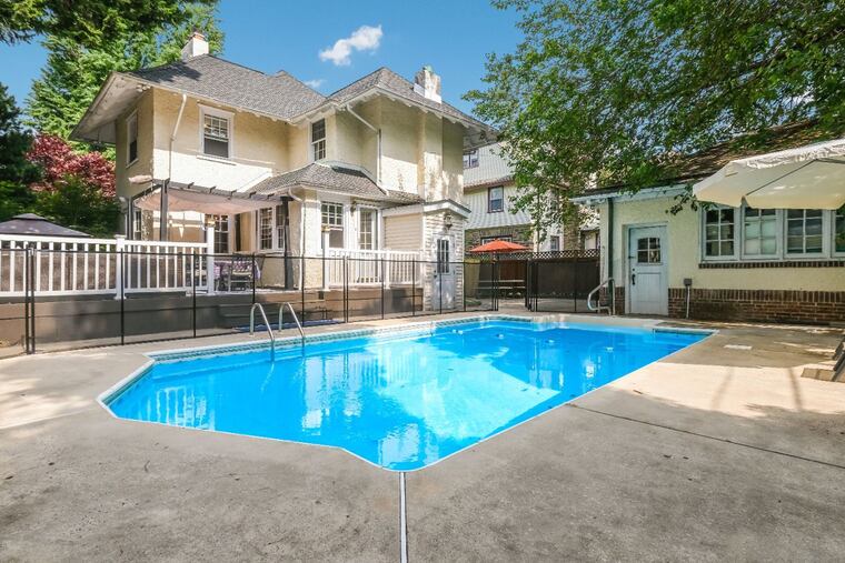 Outdoor space includes a front porch, a back patio and a pool.