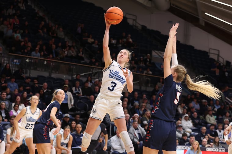 Villanova's Lucy Olsen goes up for a shot against Penn's Stina Almqvist in the second half Tuesday. Despite a comparatively quiet night for Olsen, the Wildcats picked up the win thanks in part to a career-high 18 points from fellow junior Christina Dalce.
