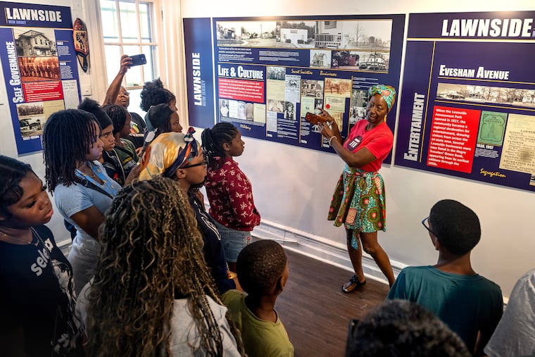 Curator Shamele Jordon leads a tour of day campers participating in Lawnside's Underground Railroad Camp during a visit to the Lawnside 100th Anniversary exhibit at the Camden County Historical Society in Camden Wednesday, July 8, 2026. A century after it was incorporated as the first Black self-governing municipality north of the Mason-Dixon Line, Lawnside is trying to preserve its past and educate a new generation about the rich history of the South Jersey community.