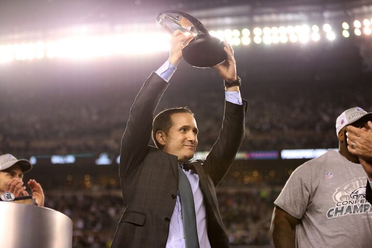 Howie Roseman, here lifting the NFC championship trophy, took advantage of the ability to roll over unused cap space from one year to the next.
