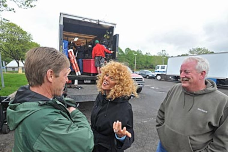 Greater Philadelphia Film Office executive director Sharon Pinkenson (center) shares a laugh with local union film production workers Bill Fiedler (left), best boy electric on the production of the movie Happy Tears, and Dan Reddy, craft services. (Clem Murray / Staff )
