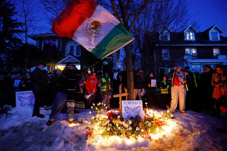 People gather for a vigil in Minneapolis after an Immigration and Customs Enforcement officer shot and killed Renee Nicole Macklin Good, a 37-year-old mother of three, on Wednesday, Jan. 7.
