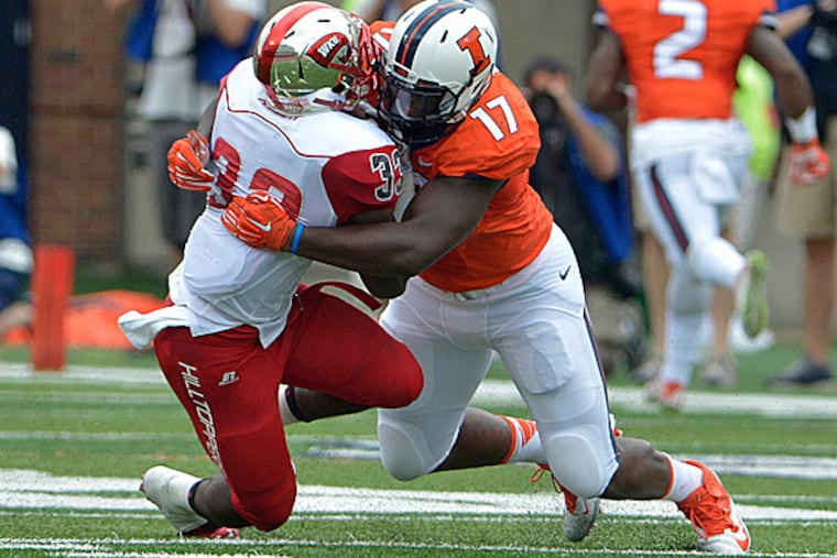 Illinois defensive end Jihad Ward tackles Western Kentucky running back Zepheniah Grimes. (Photo courtesy of the University of Illinois)