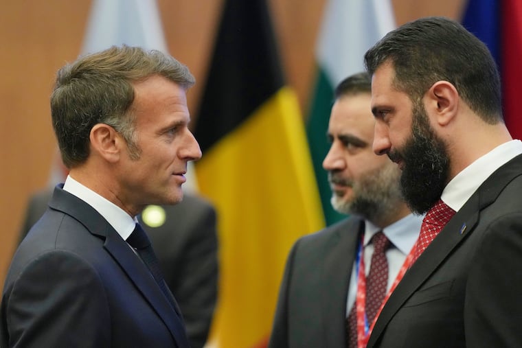 French President Emmanuel Macron, left, talks with the Syrian President Ahmad al-Sharaa during the EU Summit in Nicosia, Cyprus, April 24, 2026.