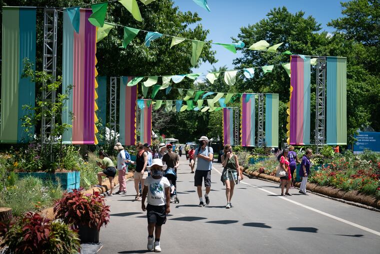 People arrive at the Philadelphia Flower Show during the preview day, at FDR Park in Philadelphia, Friday June 10, 2022.