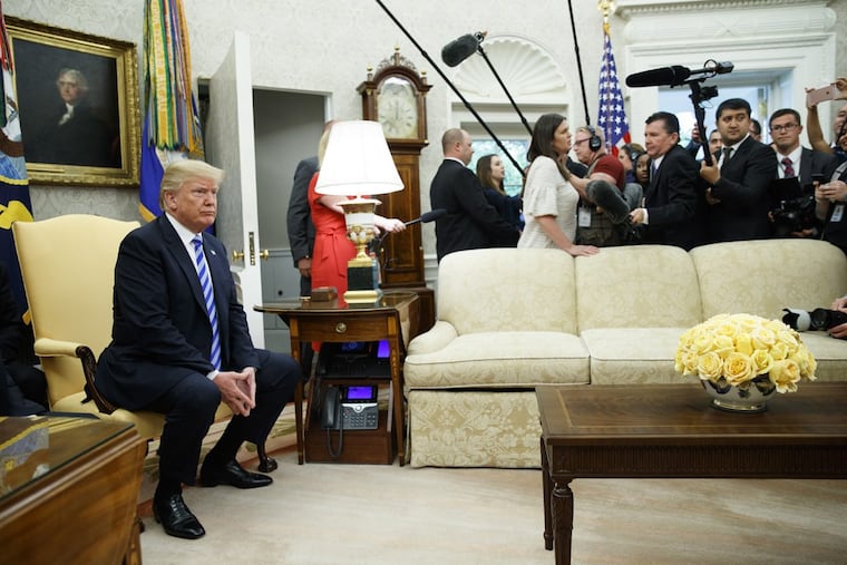 President Donald Trump listens during a meeting with Uzbek President Shavkat Mirziyoyev in the Oval Office of the White House on Wednesday.