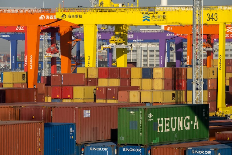 Shipping containers are stacked at a port in Tianjin, China, on Monday, Jan. 16, 2023.
