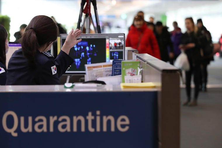 A thermal camera monitor shows the body temperature of passengers arriving from overseas at Incheon International Airport in Incheon, South Korea, Tuesday, Jan. 21, 2020. Heightened precautions were being taken in China and elsewhere Tuesday as governments strove to control the outbreak of a novel coronavirus that threatens to grow during the Lunar New Year travel rush.