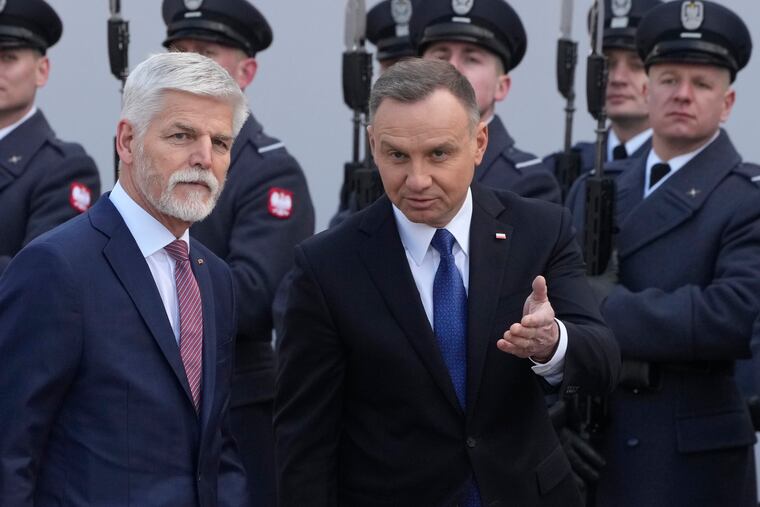 Poland's President Andrzej Duda, right, welcomes Czech Republic's President Petr Pavel as they meet at the Presidential Palace in Warsaw, Poland, on Thursday.
