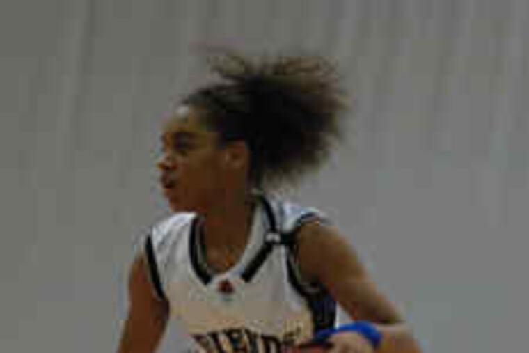 Friends' Central's Monaye Merritt checks the floor during the Friends School League championship game against Shipley. Merritt scored 11 points, but the Gators won, 56-42.