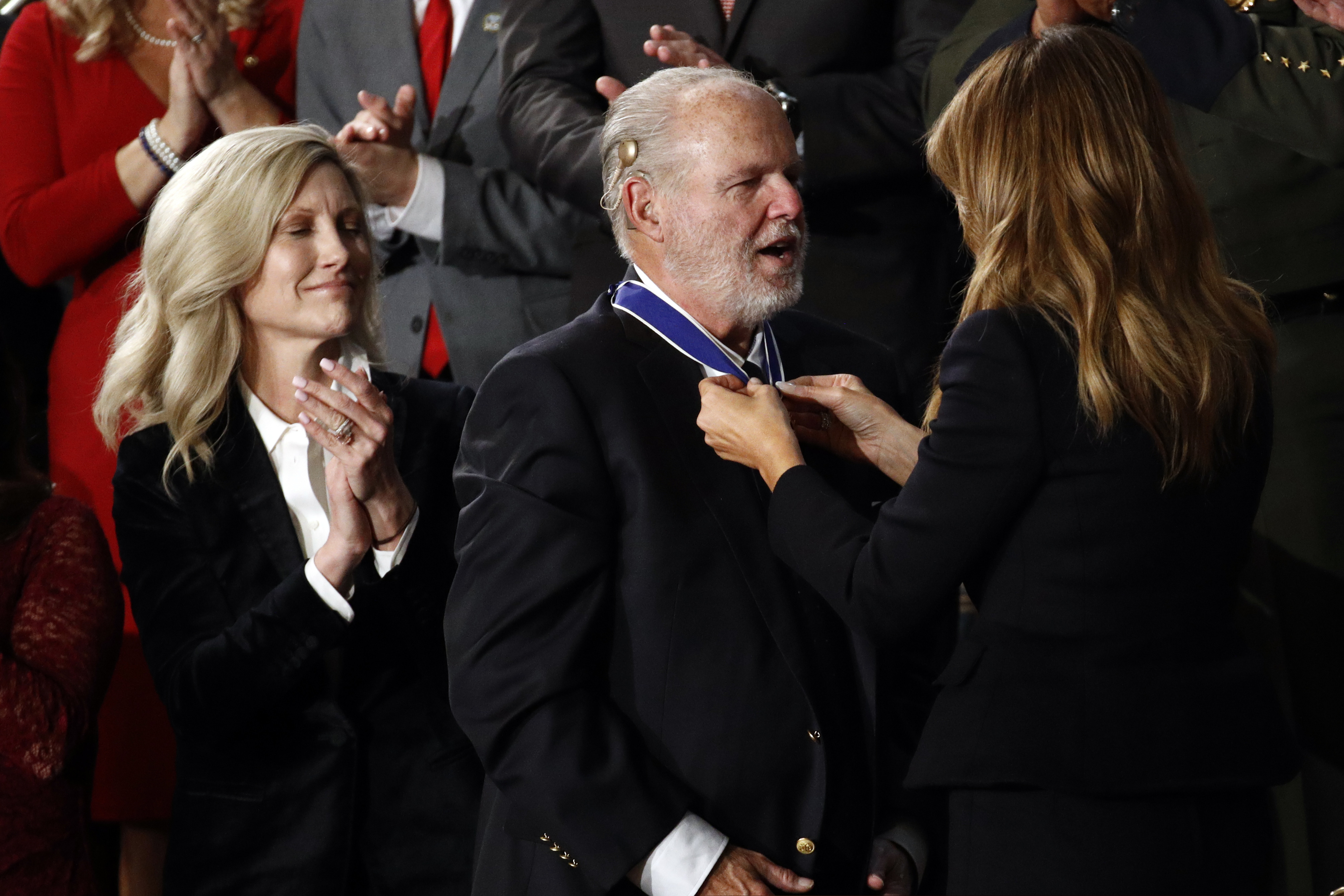 First lady Melania Trump presents the Presidential Medal of Freedom to Rush Limbaugh as his wife, Kathryn, watches during Donald Trump's State of the Union address in 2020.
