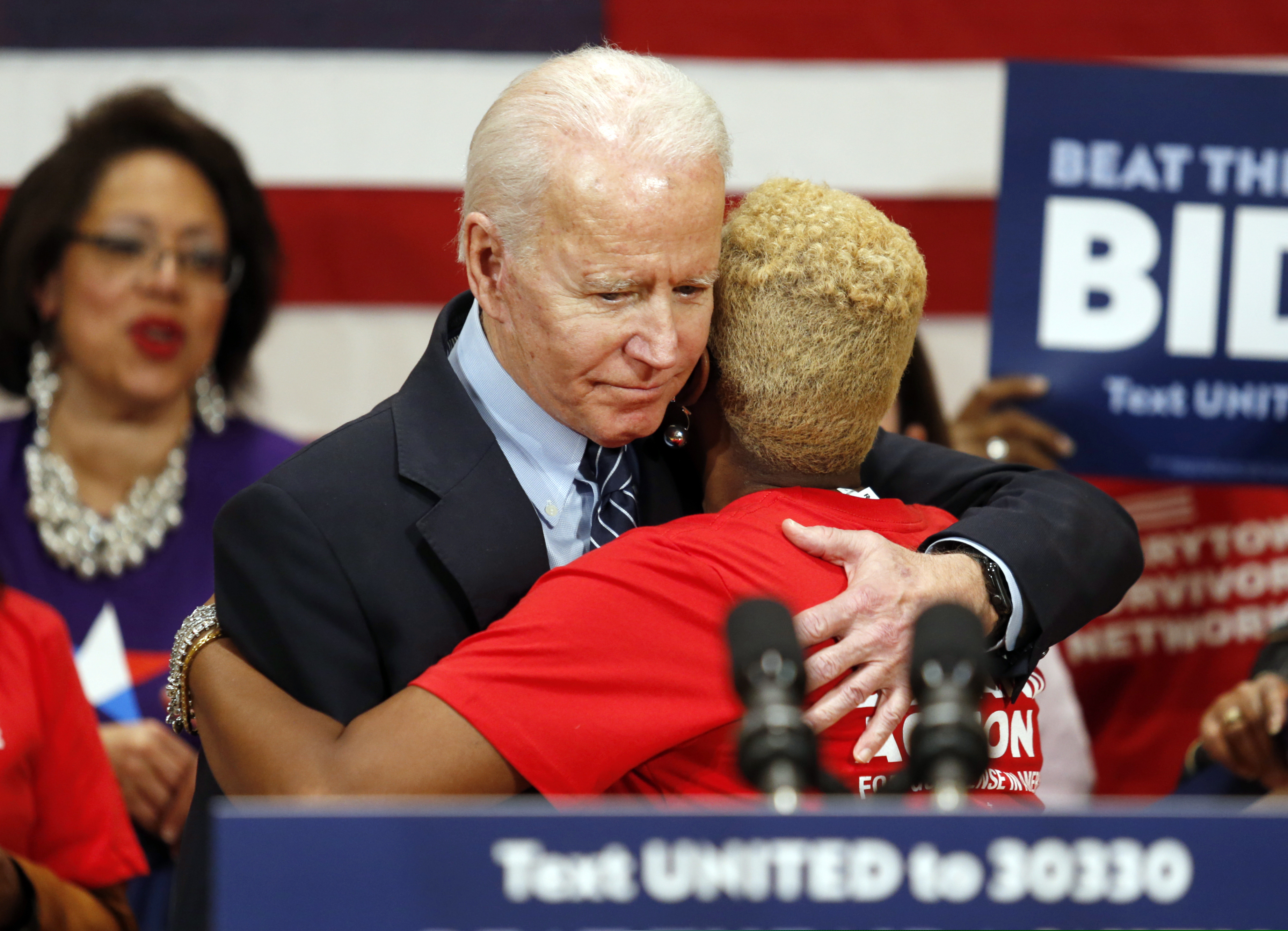 Democratic presidential candidate former Vice President Joe Biden hugs Crystal Turner of Columbus, Ohio, with Moms Demand Action during a campaign rally in Columbus, Ohio on Tuesday.