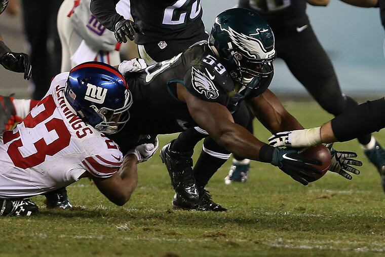 DeMecco Ryans dives on a Giants fumble.