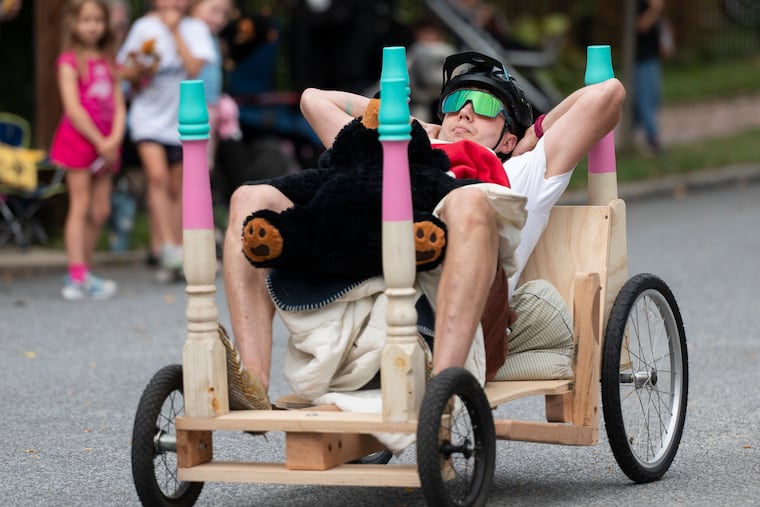 Josh Jordan rides his vehicle, “Dad Nap," at the Delco Downhill Derby, which was hosted by the Delaware County Historical Society in Media Saturday.