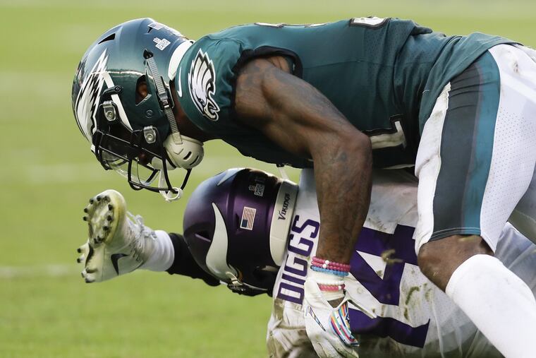 Eagles cornerback Jalen Mills taking down Vikings wide receiver Stefon Diggs on Sunday.