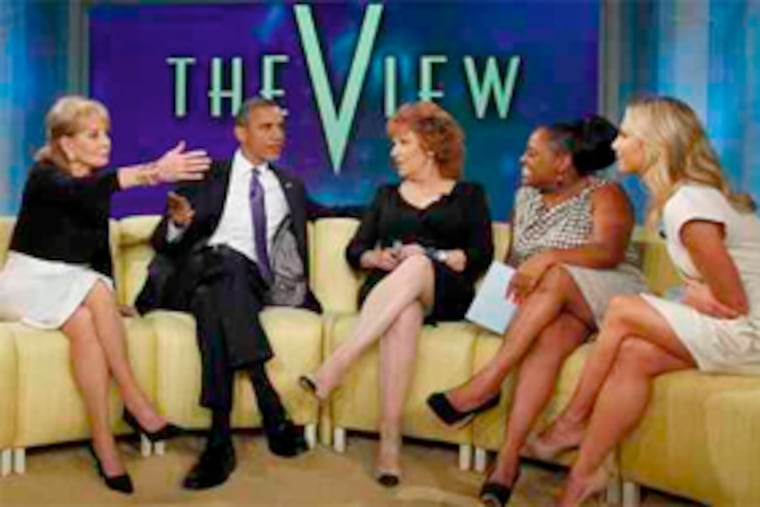 President Obama shares a sofa with (from left) Barbara Walters, Joy Behar, Sherri Shepherd, and Elisabeth Hasselbeck. (Pablo Martinez Monsivais / Associated Press)