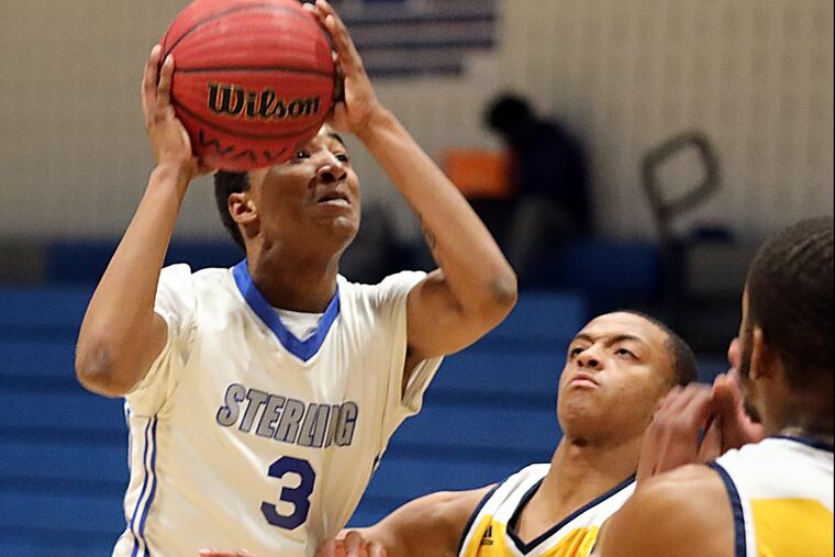 Sterling’s Chris Roe shoots over Woodbury’s Andre Parker.