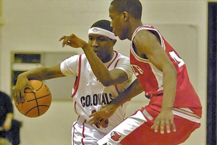 Brandon Dixon (left) and Plymouth Whitemarh defeated Upper Dublin, 63-39, in a Suburban One American game at the Colonial Elementary School gym. It was the 1,001st victory in school history. (John Costello / Staff Photographer)
