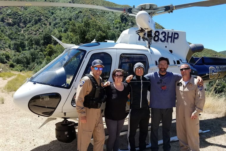 From left, California Highway Patrol rescuer Shayne Dickson, Krystal Ramirez, Hunter Whitson, Curtis Whitson and California Highway Patrol tactical flight officer/paramedic Tony Ramage after the rescue on June 16. (Joe Kingman)
