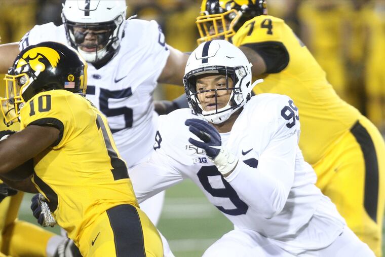 Penn State defensive end Yetur Gross-Matos tackles Iowa running back Mekhi Sargent.