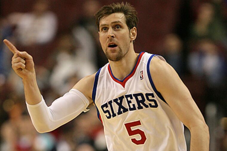 Andres Nocioni points his finger after making a three-pointer with under two minutes left in the fourth quarter. (Yong Kim / Staff Photographer)