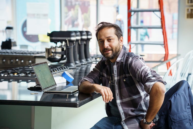 Allen Bari takes a break from setting up Hudson Table, a private kitchen where people can take classes and book food events. The counter can seat 18 people at two work stations.