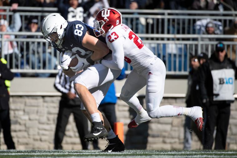 Penn State tight end Nick Bowers (83) catches a touchdown pass as Indiana defensive back Jaylin Williams (23) defends in the first quarter.