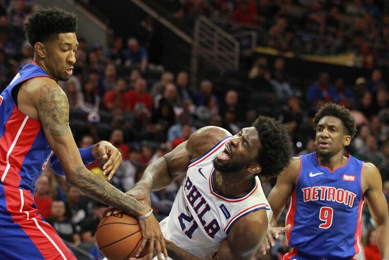 Joel Embiid gets fouled by Christian Wood during the first half. Langston Galloway is right.
