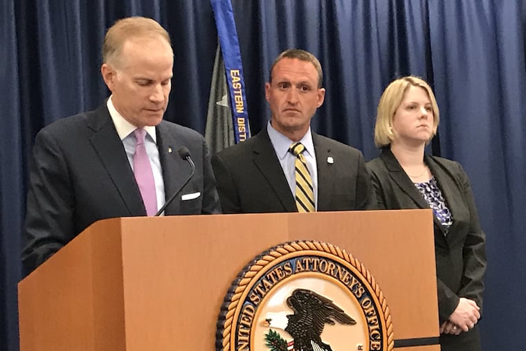 U.S. Attorney William M. McSwain, left, announces charges Tuesday against three Chinese nationals who allegedly recruited a former Montgomery County sheriff's deputy to serve as the main distributor for their online business selling fentanyl through the mail. Also pictured: William Walker, deputy special agent in charge for Homeland Security Investigations (HSI) in Philadelphia, and Assistant U.S. Attorney Clare Putnam Pozos.