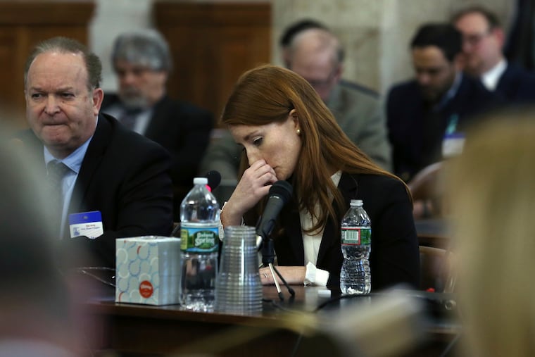 FILE: Katie Brennan, the chief of staff at the New Jersey Housing and Mortgage Finance Agency, pauses as she answers a question while testifying before the Select Oversight Committee at the Statehouse, Tuesday, Dec. 4, 2018, in Trenton, N.J. Brennan, who says Democratic Gov. Phil Murphy's campaign staff didn't take her sexual assault allegations seriously, has testified before the legislative oversight committee.