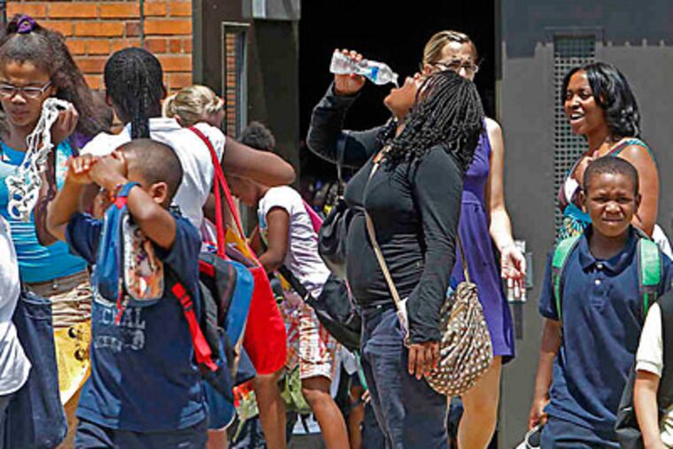 File photo: Students leave Spring Garden School in North Philadelphia in June. A school voucher bill is not about the students, says Inquirer columnist Karen Heller. (AKIRA SUWA / Staff Photographer)