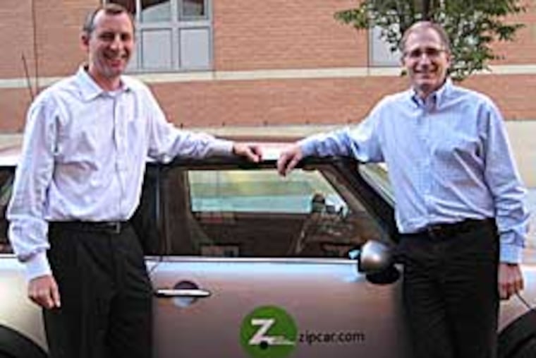 From left: Mark Norman, president and COO of Zipcar, and Scott Griffith, CEO. The for-profit carsharing company, is challenging Philadelphia-based nonprofit PhillyCarShare for city government business and local market leadership.