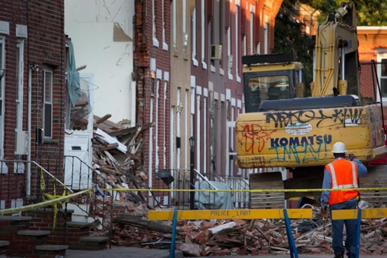 A view of the 400 block of Daly St in South Philadelphia on Tuesday morning, July 30, 2013, the day after an explosion brought down three row houses. (ALEJANDRO A. ALVAREZ/STAFF PHOTOGRAPHER)