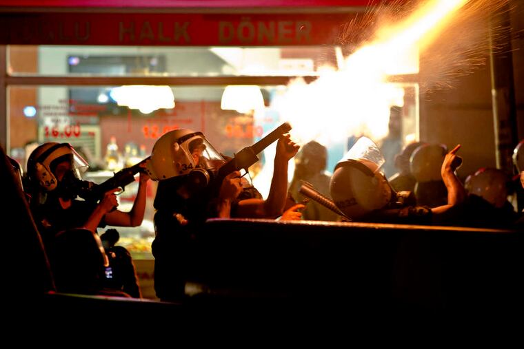 Riot police fire tear gas after chasing protesters out of Gezi Park in Istanbul . The police stormed the park Saturday after protesters ignored government appeals to end the two-week standoff.