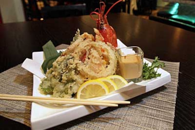 The lobster tempura is a satisfying rendition of the dish and features a
generous helping of moist crustacean along with sweet potato, carrot, and shiitake mushroom. (Elizabeth Robertson/Staff Photographer)