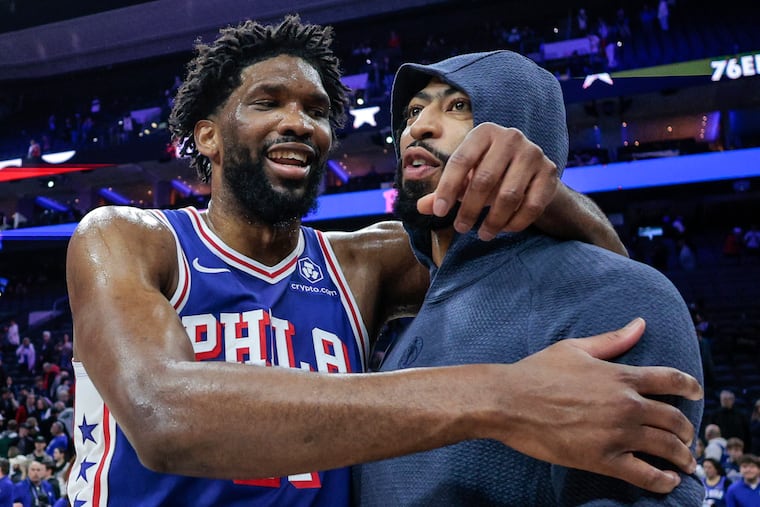 Sixers Joel Embiid hugs Mavericks Anthony Davis after losing to the Sixers 118-116 at the Wells Fargo Center Tuesday, Feb. 4, 2025, in Philadelphia. Davis was just traded to the Mavs from the Lakers.