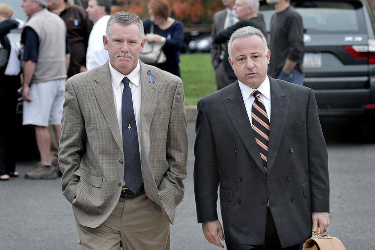 Michael Schmalz (left) faced criminal charges in 2012 for allegedly assaulting a subdued prisoner and falsifying records about the incident. Schmalz, seen here before a preliminary hearing in the case, was acquitted, but later was fired from the department. He's now a corporal in Rockledge, a small borough in Montgomery County.
