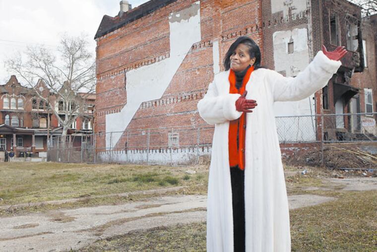 Margo Robinson in a vacant lot at 16th Street and Erie Avenue, where her project is planned. MICHAEL S. WIRTZ / Staff Photographer