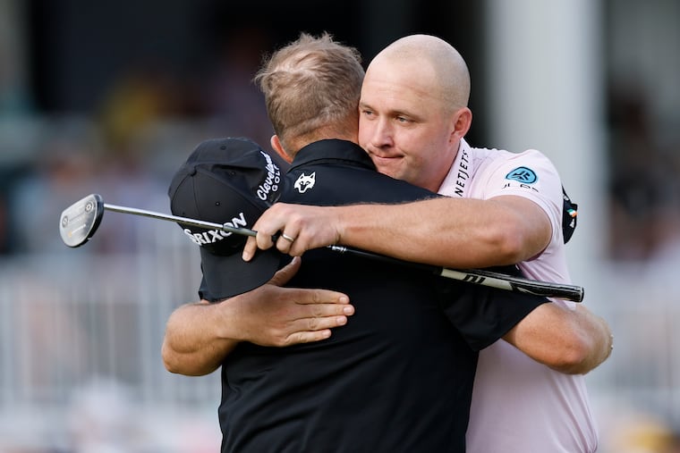 Sepp Straka (right) celebrates winning the Truist Championship as he embraces Shane Lowry, who finished tied for second.