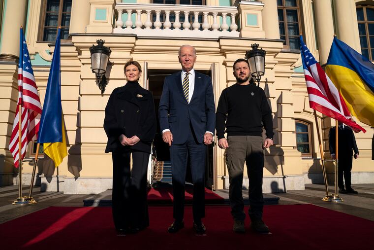 President Joe Biden, center, poses with Ukrainian President Volodymyr Zelenskyy, right, and Olena Zelenska, left, spouse of President Zelenskyy, at Mariinsky Palace during an unannounced visit in Kyiv, Ukraine, on Monday.