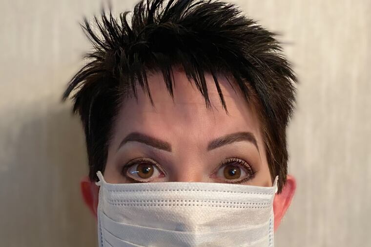 Makeup artist Cindy Singer showing off her eyes behind the mask. Her tip. Dust neutral eyeshadow above the lid, use liquid eyeliner on the top and bottom lid and a heavy dose of mascara. And of course make sure your brows are arched, they frame the face.